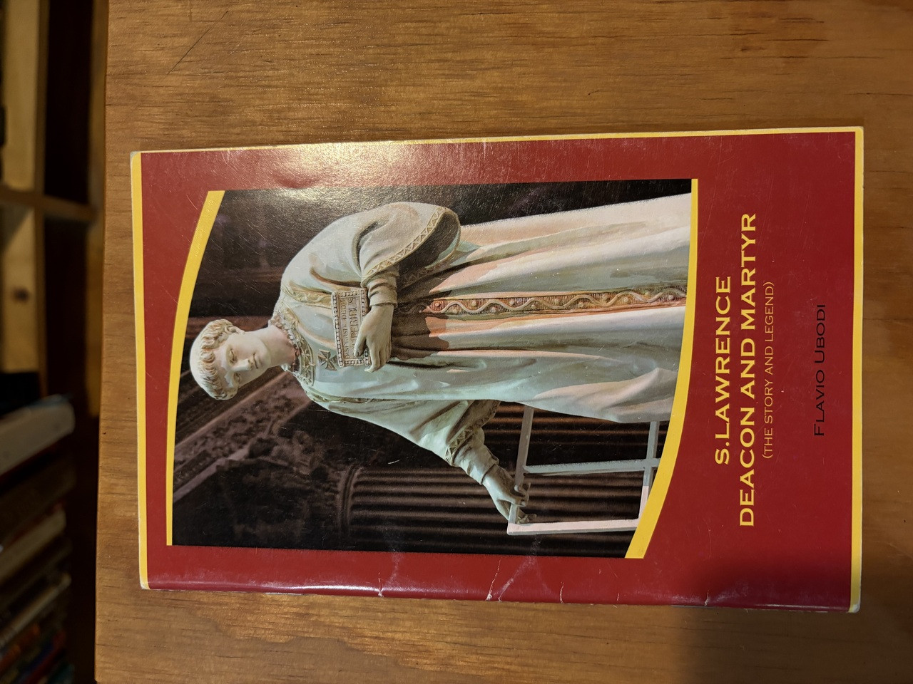S. LAWRENCE DEACON AND MARTYR (THE STORY AND LEGEND) BY FLAVIO UBODI - 2008. - ST. LAWRENCE IS ONE OF THE MOST ILLUSTRIOUS AND MOST VENERATED SAINTS IN ROME AND IN THE WHOLE WORLD.  A GENTLY USED BOOK IN GOOD CONDITION.