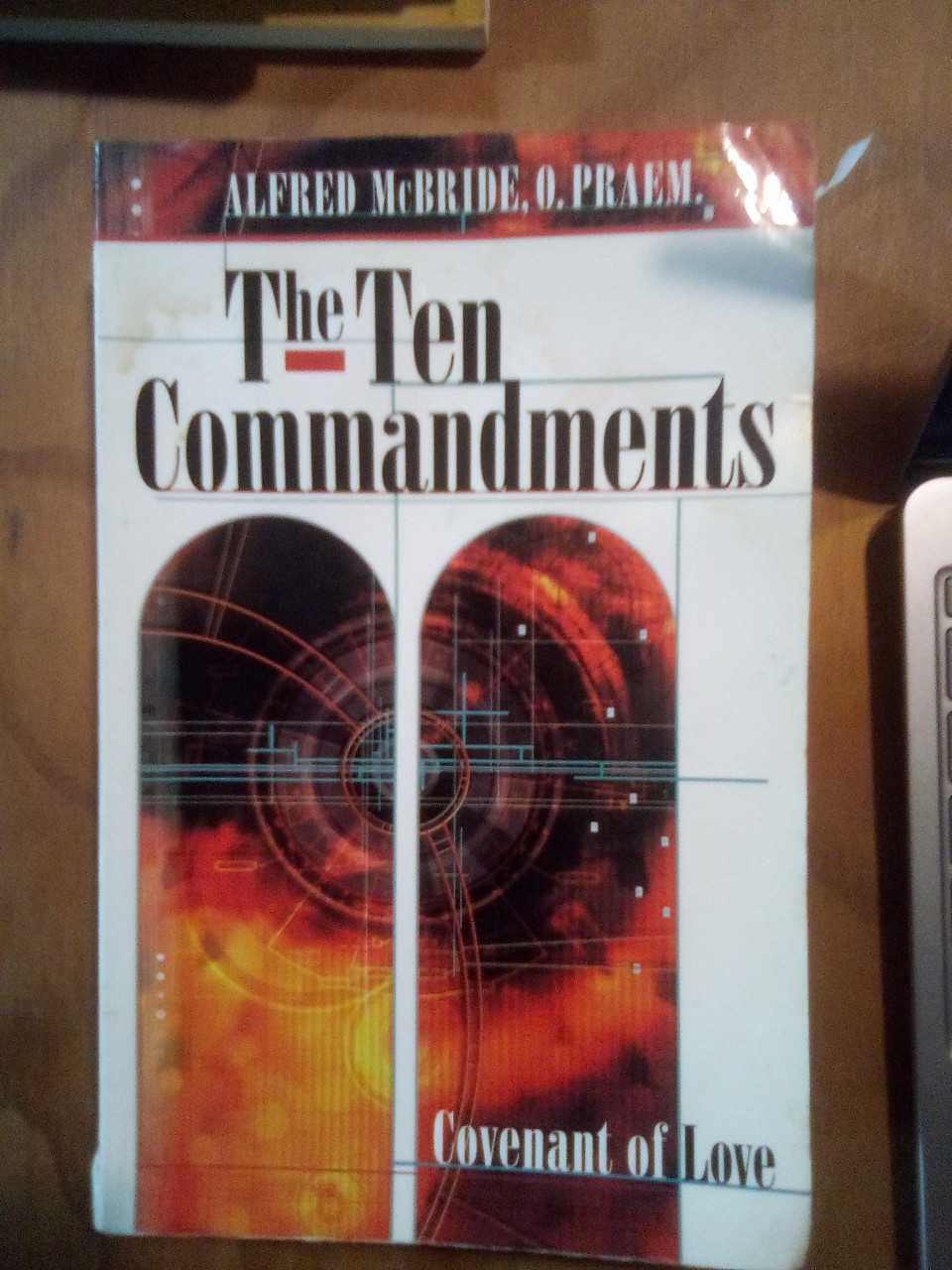 The Ten Commandments: Covenant of Love Paperback – January 1, 2001 by Alfred McBride (Author), O. Praem (Author)

A used book with a little tear at the top and pages has "dog ears" but in okay condition.   

Entertaining, literate, thought-provoking, this instructive guide to the Ten Commandments is designed to be used equally well by individuals or small groups. Each commandment is introduced through an illustrative story, followed by a question about keeping the commandment. Next, Father McBride offers three strategies for doing so taken from the Catechism of the Catholic Church