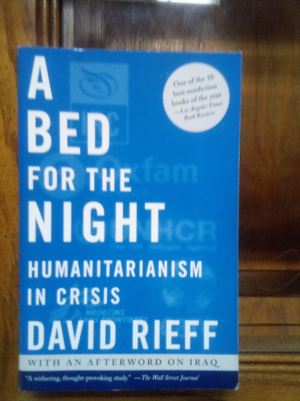 A Bed for the Night: Humanitarianism in Crisis Hardcover – October 1, 2002 by David Rieff (Author) - THIS IS A USED BOOK IN OKAY CONDITION WITH THE PAGES A LITTLE BROWN - 

Timely and controversial, A Bed for the Night reveals how humanitarian organizations trying to bring relief in an ever more violent and dangerous world are often betrayed and misused, and have increasingly lost sight of their purpose. Humanitarian relief workers, writes David Rieff, are the last of the just. And in the Bosnias, the Rwandas, and the Afghanistans of this world, humanitarianism remains the vocation of helping people when they most desperately need help, when they have lost or stand at risk of losing everything they have, including their lives. Although humanitarianism's accomplishments have been tremendous, including saving countless lives, the lesson of the past ten years of civil wars and ethnic cleansing is that it can do only so much to alleviate suffering. Aid workers have discovered that while trying to do good, their efforts may also cause harm. Drawing on firsthand reporting from hot war zones around the world -- Bosnia, Rwanda, Congo, Kosovo, Sudan, and most recently Afghanistan -- Rieff describes how the International Committee of the Red Cross, Doctors Without Borders, the International Rescue Committee, CARE, Oxfam, and other humanitarian organizations have moved from their founding principle of political neutrality, which gave them access to victims of wars, to encouraging the international community to take action to stop civil wars and ethnic cleansing. This advocacy has come at a high price. By calling for intervention -