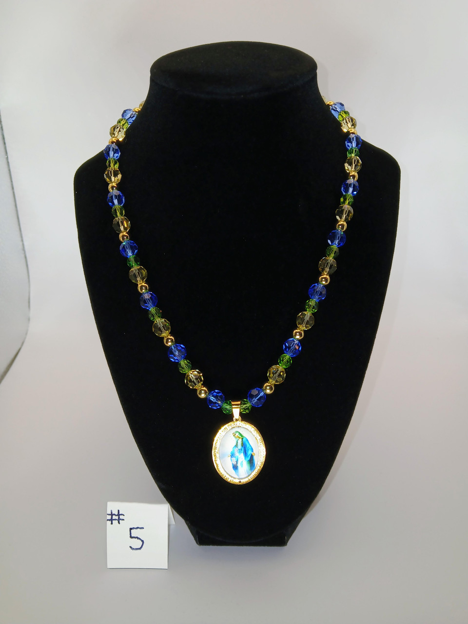 Beautiful Miraculous Medal of Our Holy Mother Mary that is PVD gold plated stainless steel joined to a shimmering 18 inch Princess crystal glass bead necklace