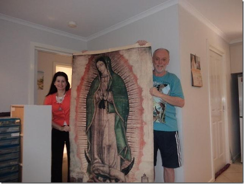 Irene and Mario M display tilma of Our Lady of Guadalupe