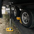 Camco RV Stabilizer Jack Pads — 6 3/16" x 6 3/16" Support Area — Resin Pads Keep Jacks from Sinking into the Ground — Interlocking Design with Handy Storage Strap — 4-Pack — Yellow — Made in the USA 44595