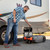 Camco Rhino Camper/RV Portable Waste Tank – 36-Gallon – Features Steerable No-Flat Front Wheels & Built-In Gate Valve – Includes Removable 24" Tow Bar, 3' RV Sewer Hose, & More RV Accessories 39007