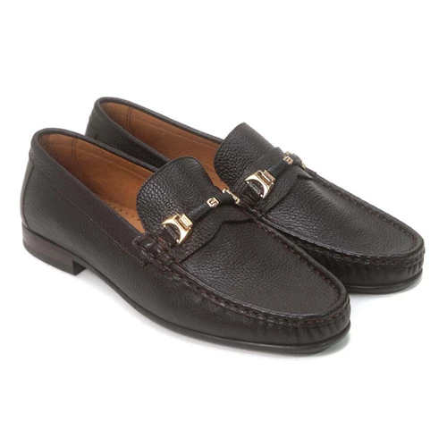 Close-up of grain leather texture on brown formal slip-on shoe