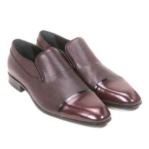 Angled view of Golden Pass men's brown slip-on dress shoe showing double gore panels