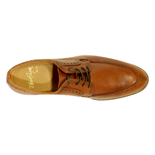 Top-down view of the Wembley II's split-toe detail and burnished leather grain in antique honey