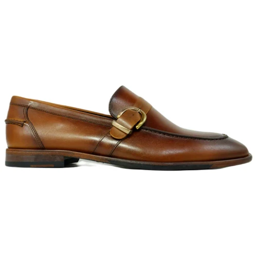 Side profile of cognac buckle loafer showing strap hardware and painted leather grain
