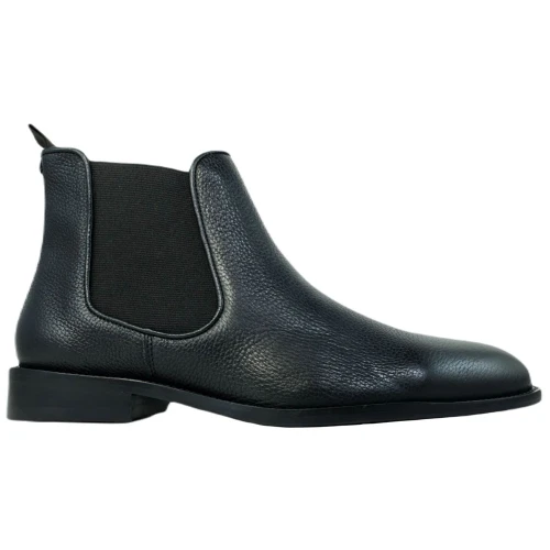 Side profile of black Chelsea boot showing elastic gusset and pull tab detail