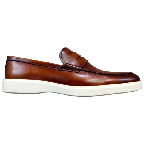 Side profile of cognac penny loafer showing hand-painted leather grain and penny strap detail