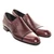 Pair of burgundy double gore slip-on dress shoes styled for business wear