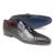 Mario Manzoni tassel loafers showing leather sole and heel construction
