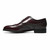 Side profile of the Florsheim Lexington burgundy leather wingtip oxford showing full brogue detailing
