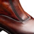 Mezlan Maverick 21927 – close-up of hand-burnished patina calfskin surface texture in Chocolate Rust