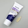 Applying TriDerma bruise relief cream to arm bruise – non-greasy formula for reducing discoloration and swelling
