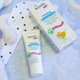 TriDerma Baby All Purpose Healing Cream being used on baby's cheek – safe for drool rash and dry patches on face