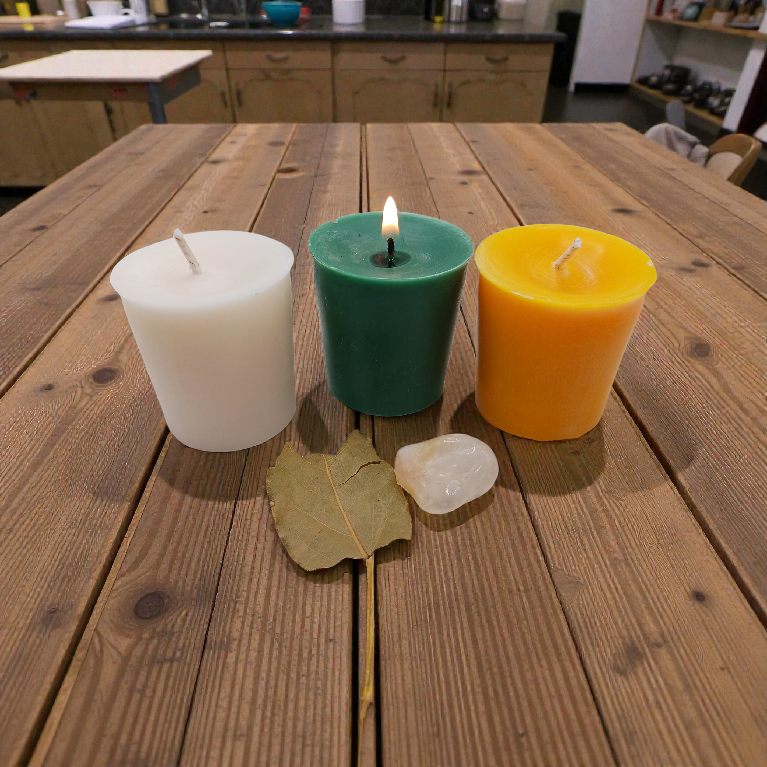 Lit prosperity ritual candle with herbs