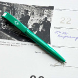 Grüner Kugelschreiber mit Raute auf Terminkalender