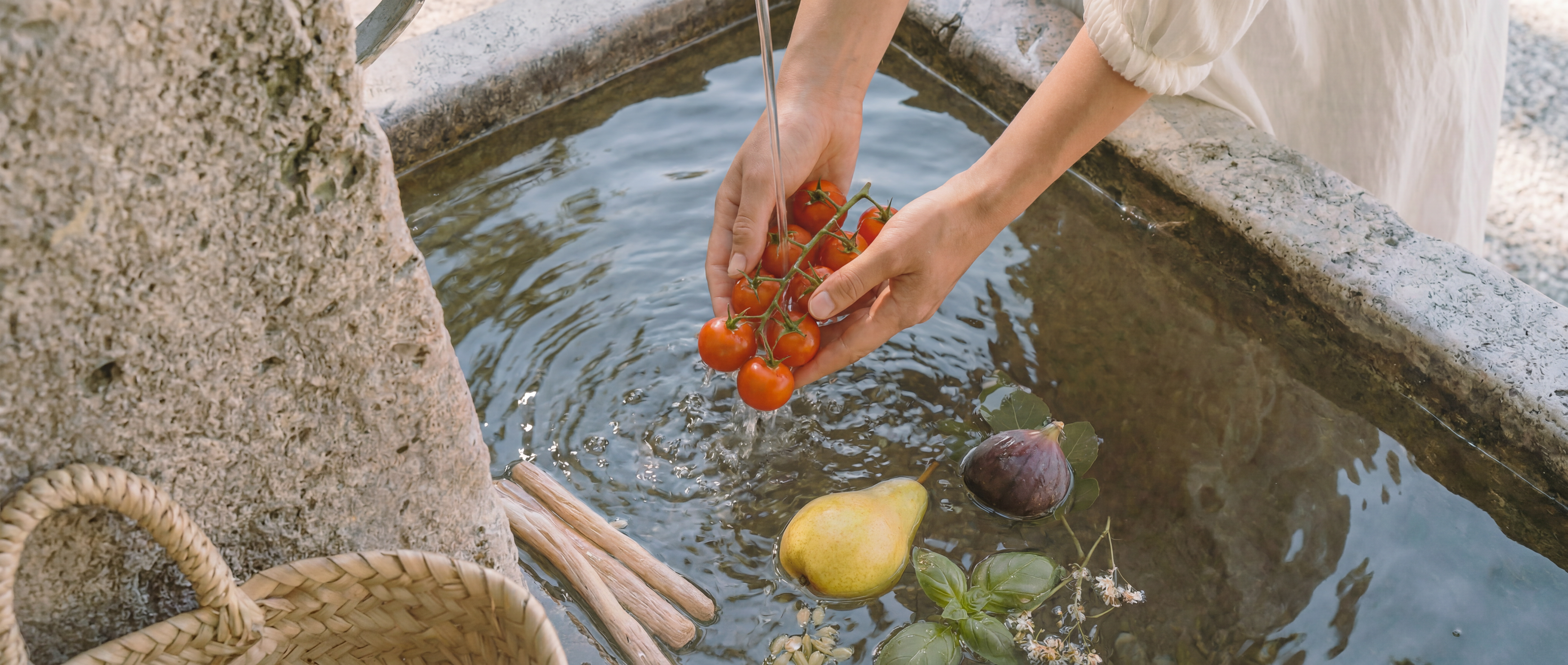 lady washing vegetables in an Italian fountain