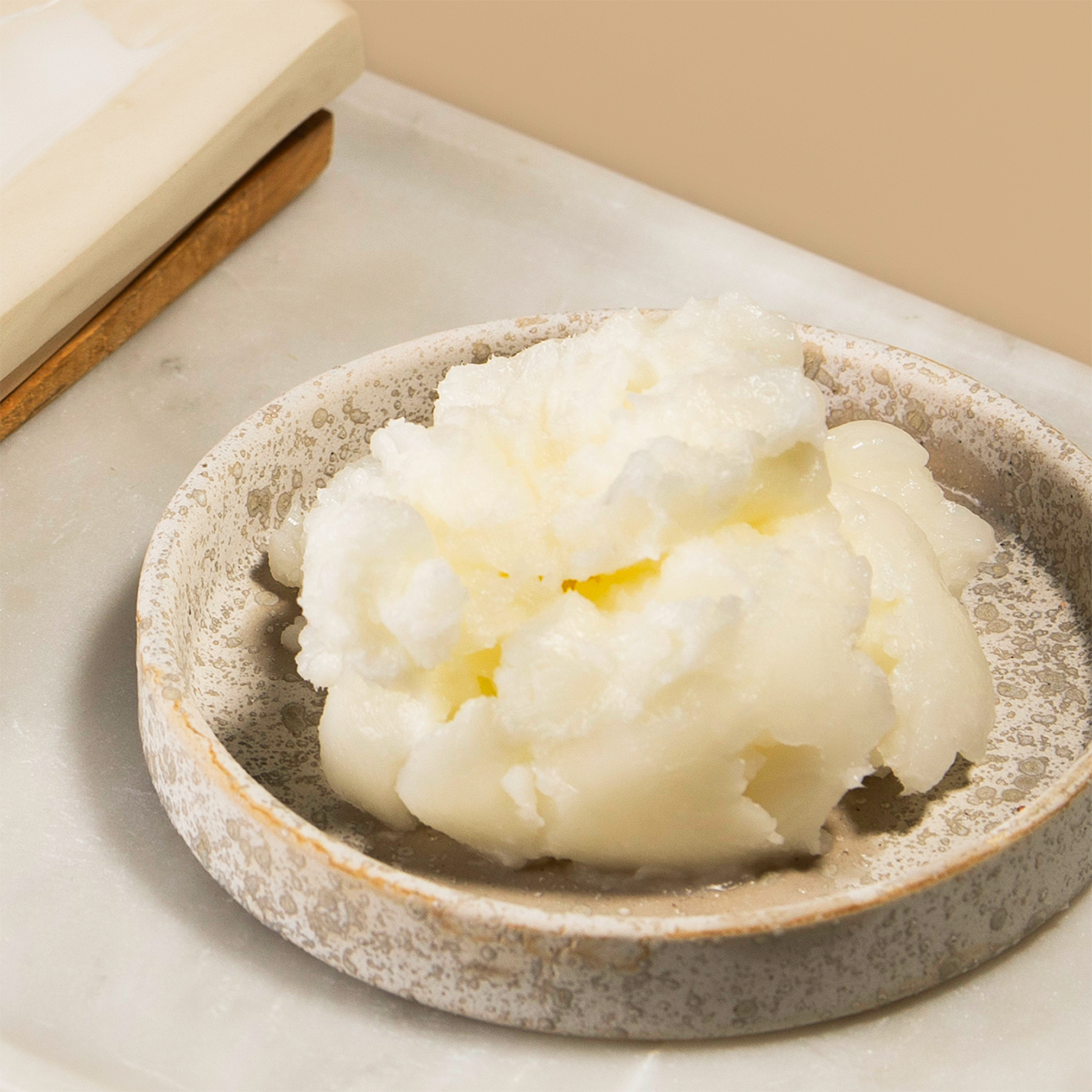 Coconut carrier oil in a dish