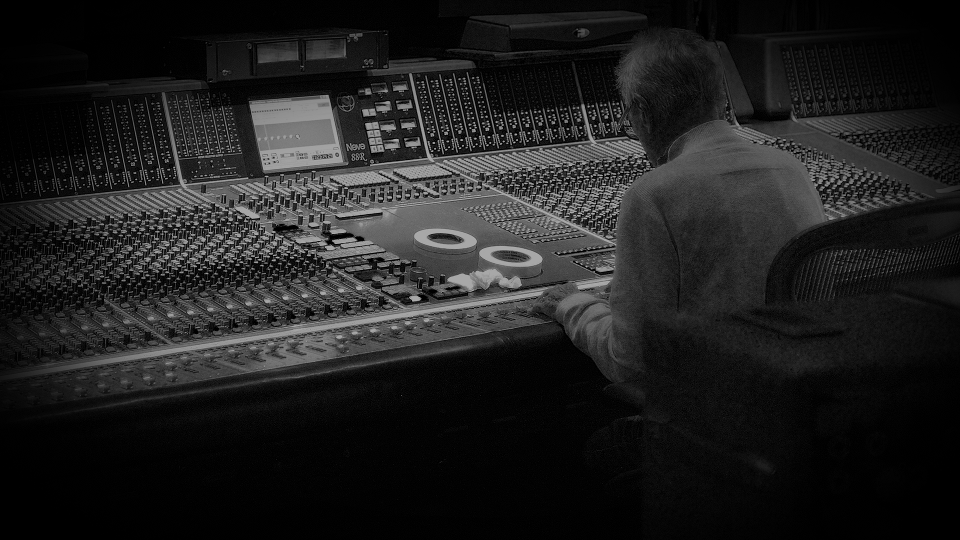 man behind mixing board