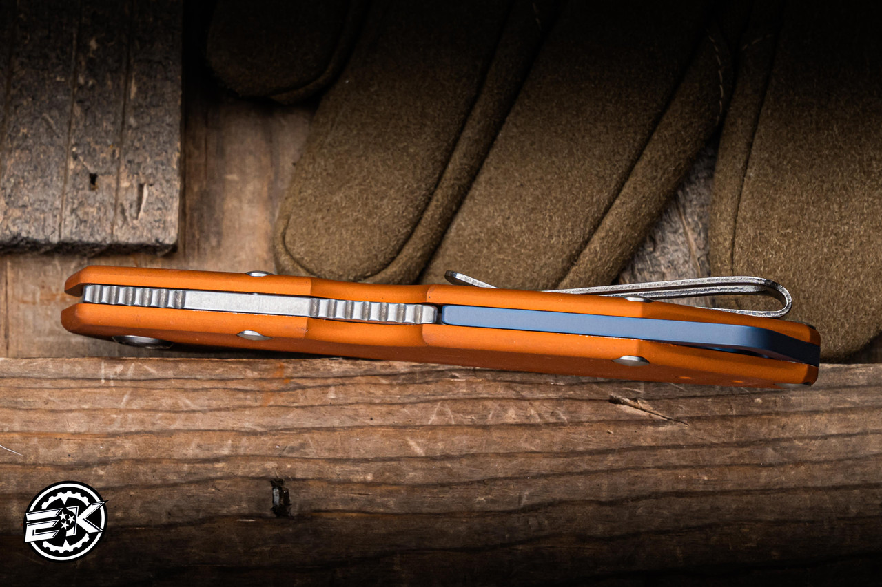 Buck 724 Mustang Orange Aluminum Backlock 3.25