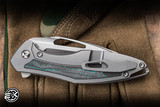 Koenig Knives Mini Arius Flipper Knife Titanium/Teal Camo Carbon Inlay 3" M390 Drop Point Brightwashed Polished Flats