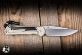 Preowned-Chris Reeve Knives Large Sebenza 31 Folding Knife Champagne Titanium/Black Diamond Richlite Inlay 3.6" MagnaCut Drop Point Stonewash 