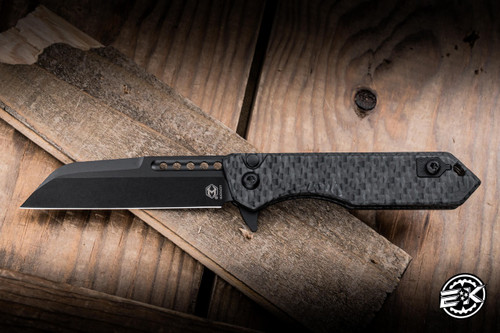 Heretic Knives Jinn Button Lock Manual Flipper Knife DLC Glow Carbon Fiber 3" MagnaCut Wharncliffe DLC H213-6A-GLOCF