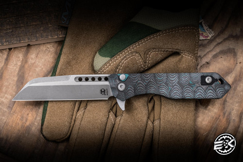 *EKCLUSIVE* Heretic Knives Jinn Button Lock Flipper Knife Shipwreck CamoCarbon 3" MagnaCut Wharncliffe Battleworn H213-7A-SHIPCF