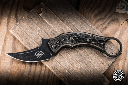 Preowned-Bastinelli Knives Mako Folder Knife 2 Saints Sculpted Bronze Skulls 2.6" N690 Karambit Black Stonewash