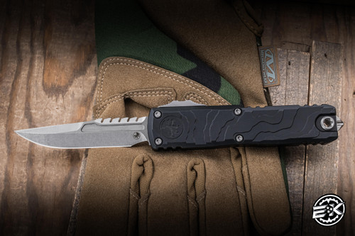 Microtech UTX-85 Gen IV OTF Automatic Knife Topographic Engraved Black Aluminum 3.1" M390 Clip Point Stonewash 12354TP-10S