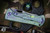 John Gray Rostrum Carbon Fiber, Green Barked Titanium 3.25" Satin Tanto