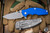 Rick Hinderer Knives Jurassic Slicer Hollow Ground-Blue G10 3.4″ MagnaCut Working Finish