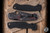 Pre-Owned Spyderco PM2 Folding Knife Red Shred Carbon Fiber 3.42" S45VN Spearpoint Black DLC