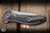 Pre-Owned We Knife Synergy 2v2 Flipper Knife Gray Titanium, Shredded Carbon Fiber Inlay 3.5" 20CV Drop Point Polished Bead Blasted