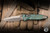 Microtech Marfione Select Socom RAM-LOK Manual Folding Knife Antique Green Slab Titanium 4" M390 Spearpoint Bronze Stonewash 160RLS-13SMS1
