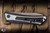 Preowned-ProTech 2025 Oligarch Custom 003 Automatic Folding Knife 2 Tone Weave Textured Stainless Steel 3.25" MagnaCut Wharncliffe Smokey Grey DLC