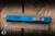 Preowned-Microtech Scarab II Executive OTF Automatic Knife Blue Aluminum 4" M390 Drop Point Apocalyptic Serrated 1176-11APBL