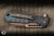 Heretic Knives Jinn Button Lock Manual Flipper Knife Camo Carbon 3" Wharncliffe Bronze H213-7A-SHIPCF