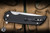 ProTech Mordax Manual Flipper Knife Black Aluminum/Casted White Brass "USA 250th", White Pearl Button 3.75" MagnaCut Stonewash - Blade Show Exclusive