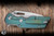 A2D Attn2Detail Mercantile Mark 1 Large Folding Knife Contoured Double Divet Shipwreck Anodized Titanium 4" MagnaCut Drop Point Rising Grind - Blade Show Exclusive