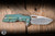 A2D Attn2Detail Mercantile Mark 1 Large Folding Knife Contoured Double Divet Shipwreck Anodized Titanium 4" MagnaCut Drop Point Rising Grind - Blade Show Exclusive