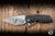 A2D Attn2Detail Mercantile Mark 1 Large Folding Knife Contoured Black Wash Frag Titanium 4" MagnaCut Drop Point Hissatsu Compound Grind - Blade Show Exclusive