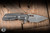 A2D Attn2Detail Mercantile Mark 1 Large Folding Knife Contoured M-16 Grip Stonewash Titanium 4" MagnaCut Drop Point Hissatsu Compound Grind - Blade Show Exclusive