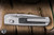 Remette RT-Aurora Crossbar Lock Folding Knife Titanium/Black Carbon Fiber Inlay 3.35" M390 Drop Point Pearlescent Aura-D