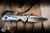 Left Handed-Chris Reeve Knives Small Sebenza 31 Folding Knife Unique Graphic w/ Lolite 3" MagnaCut Drop Point Polished S31-1409-0528-2