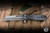 *EKCLUSIVE* Heretic Knives Jinn Button Lock Flipper Knife Shipwreck CamoCarbon 3" MagnaCut Wharncliffe Battleworn H213-7A-SHIPCF