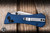 Auxiliary Manufacturing Deadhead Coffin Folding Knife Blue Micarta, Red Accent 2.8" 14C28N Tanto Stonewash