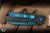 Heretic Knives "Jinn" Automatic Folding Knife Black Carbon Fiber 3" MagnaCut Wharncliffe Metallic Teal H113-MT-CF