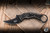 Preowned-Bastinelli Knives Mako Folder Knife 2 Saints Sculpted Bronze Skulls 2.6" N690 Karambit Black Stonewash